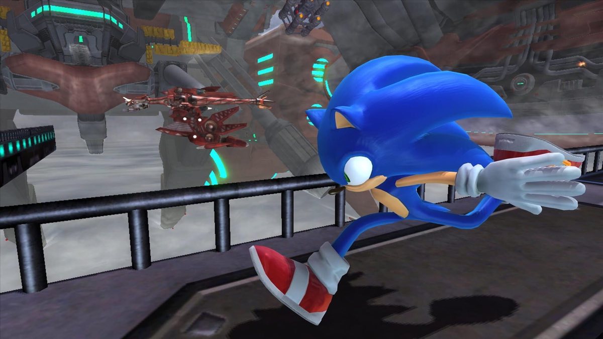 Sonic running past an Egg Fleet airship in a futuristic industrial setting